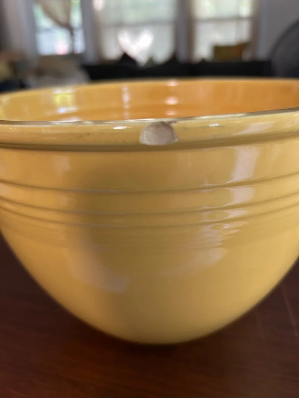 Vintage fiestaware yellow mixing bowl two chips on the rim, 8 3/4”wide x 6 1/2”